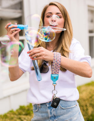 Load image into Gallery viewer, Keep on Cruisin Keychain in Turquoise on wrist with keys #color_turquoise