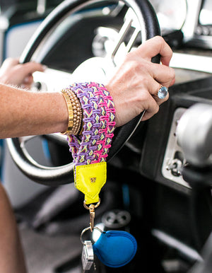 Load image into Gallery viewer, Keep on Cruisin Keychain in Neon Yellow on wrist with keys #color_neon_yellow