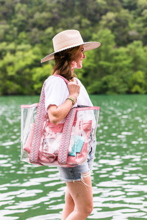 Load image into Gallery viewer, Woman by lake water with bring on the beach bag in rose with multiple pouches inside the beach tote. #color_rose