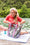 Load image into Gallery viewer, Woman by a lake using a bring on the beach bag that is easy to clean and waterproof #color_anchor

