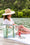 Load image into Gallery viewer, Woman sitting on doc by lake with Bring on the Beach Bag in Seafoam #color_seafoam
